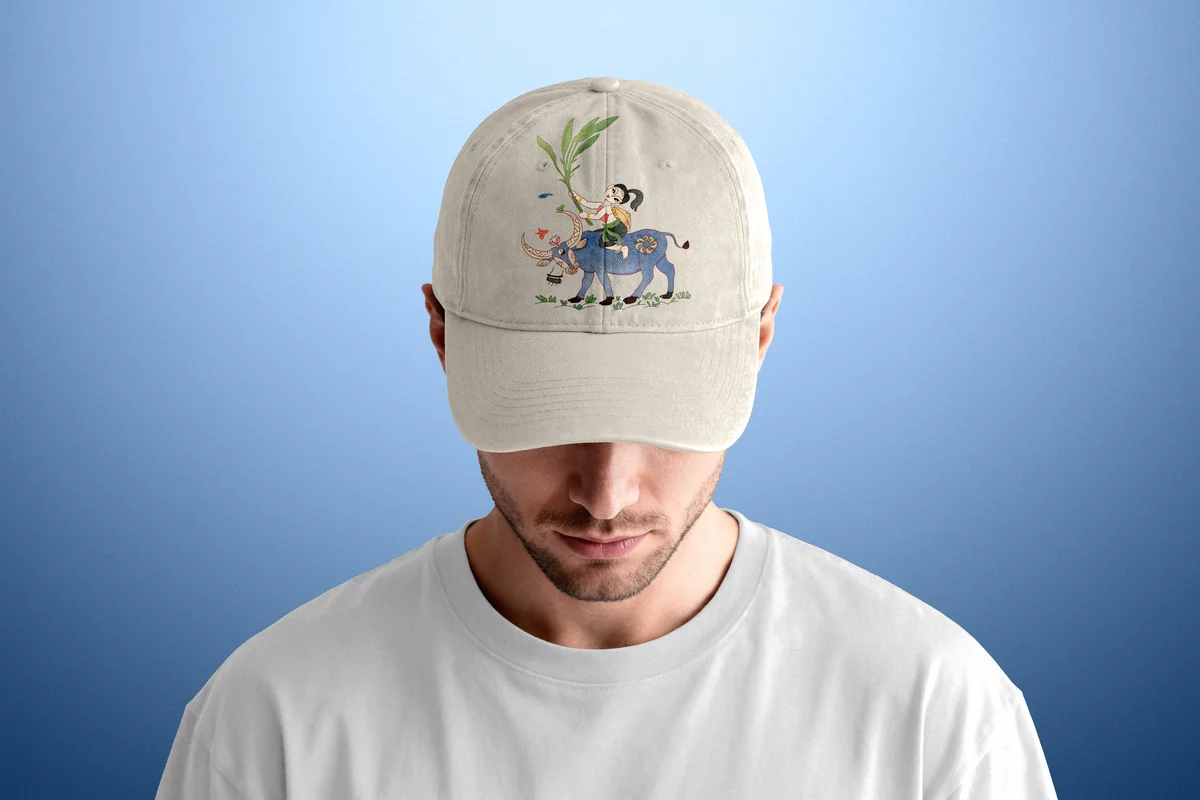 Enzyme washed cotton twill cap featuring embroidered Muc Dong Thoi Tieu on water buffalo