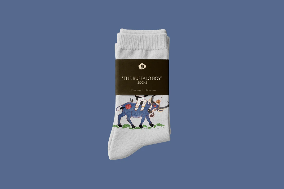 Ribbed crew socks featuring Muc Dong print with custom TDH kraft belly-band packaging