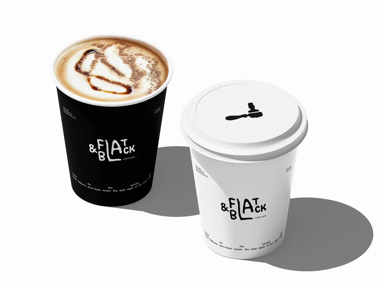 Two Flat & Black takeaway cups, one black, one white