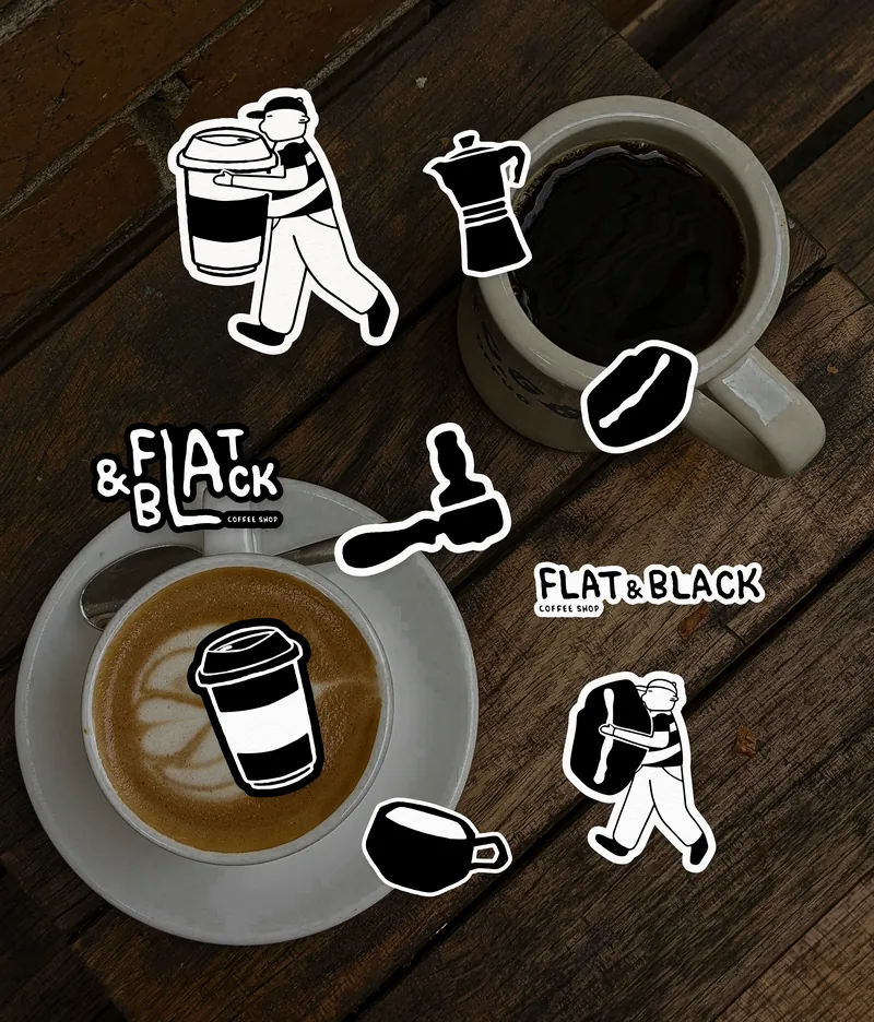 Die-cut stickers scattered on a timber table beside a flat white: the carrier with a takeaway cup, a moka pot, a bean, a portafilter, the wordmark.