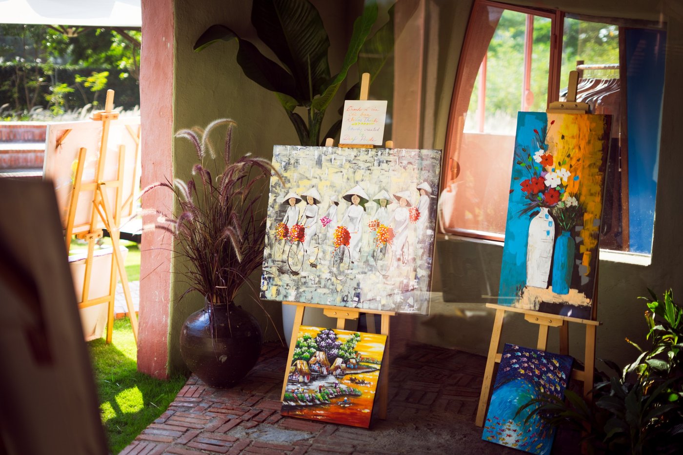 Paintings on easels in the garden