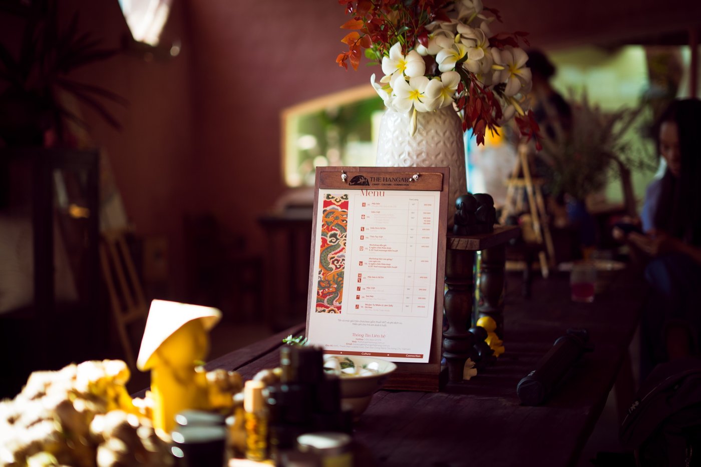 Menu board on an easel among flowers