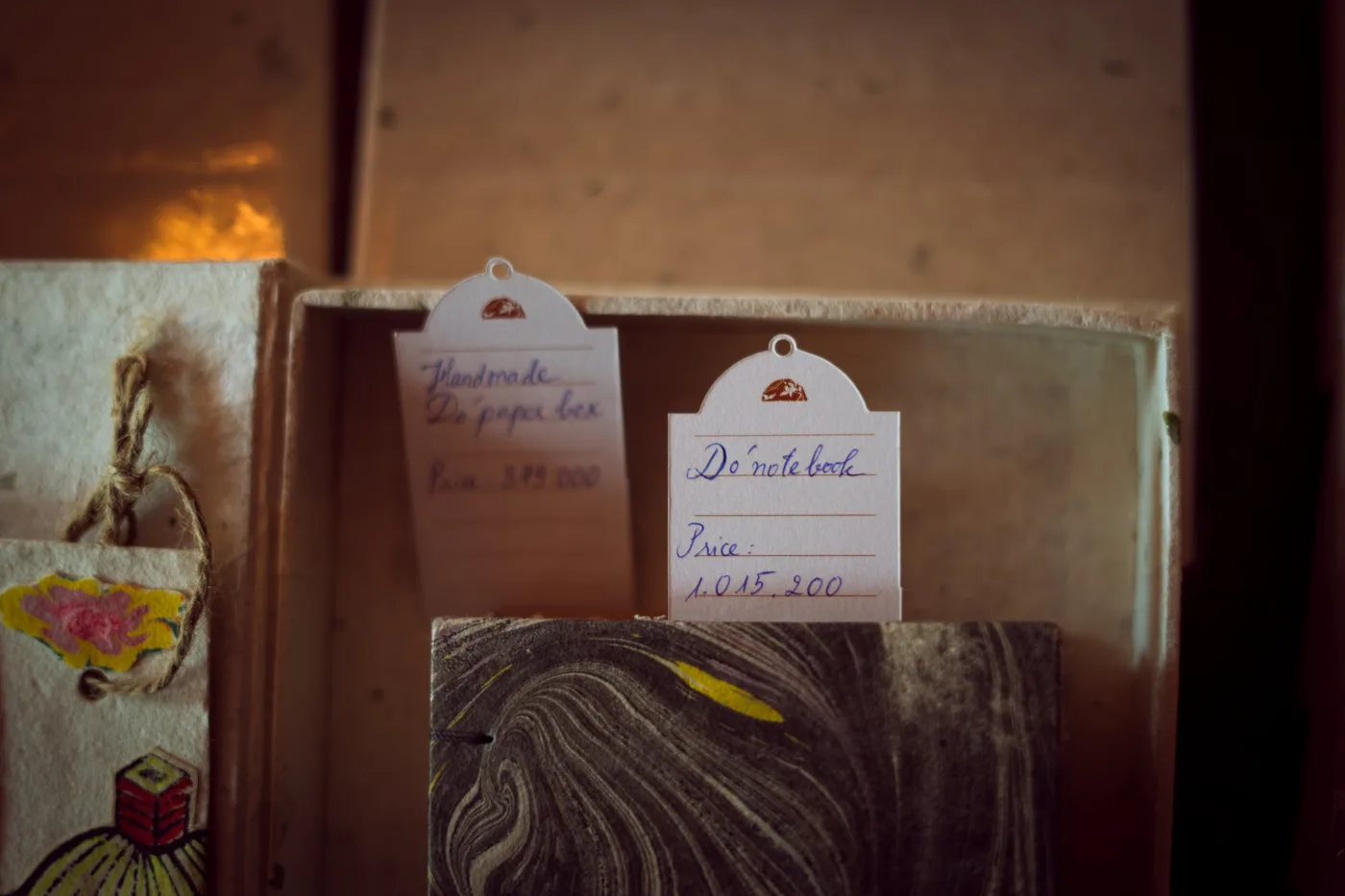 Handwritten price cards on the shelf