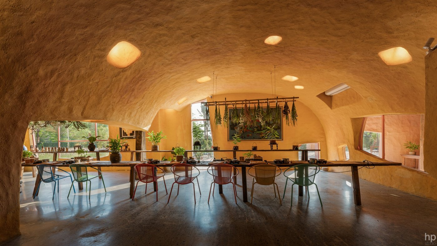 The long tables under the ochre vault