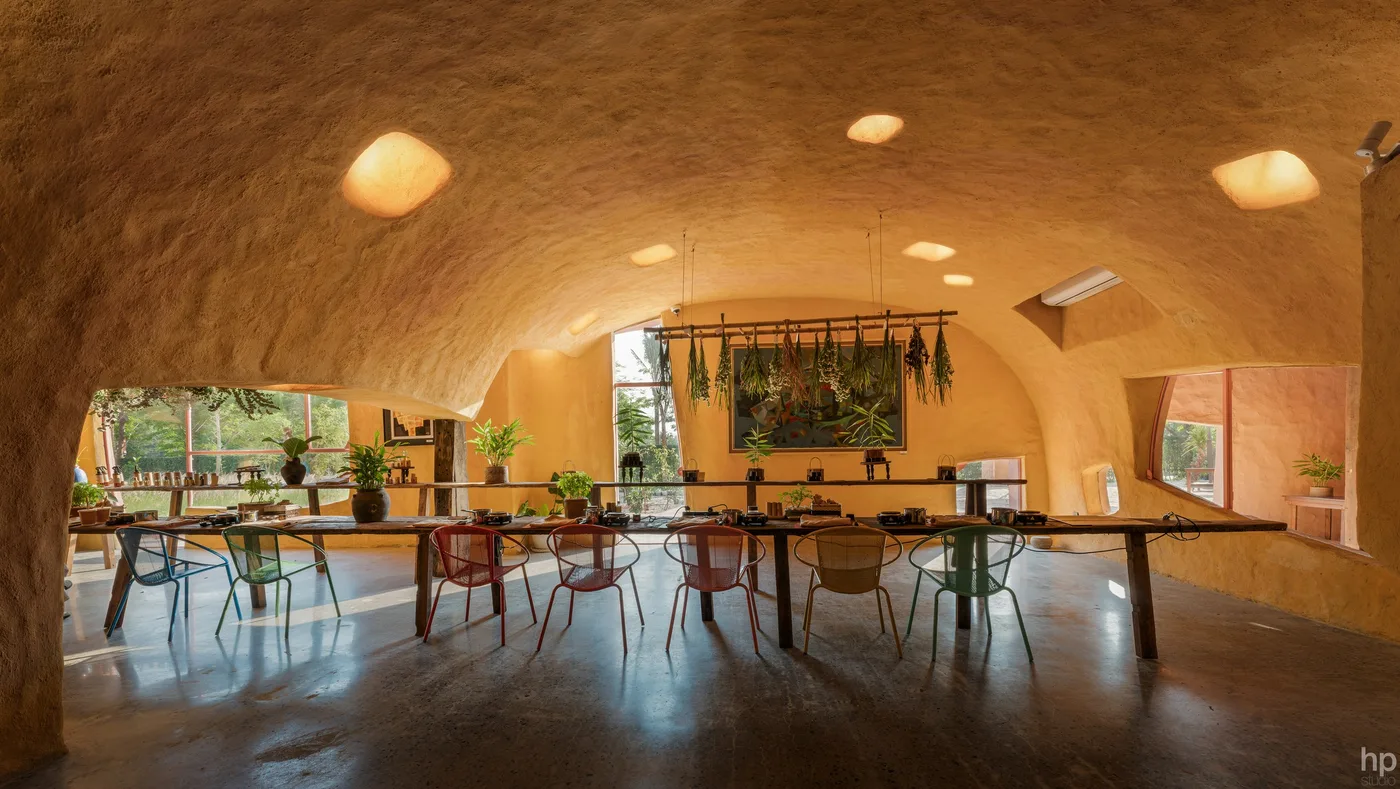 The long tables under the ochre vault