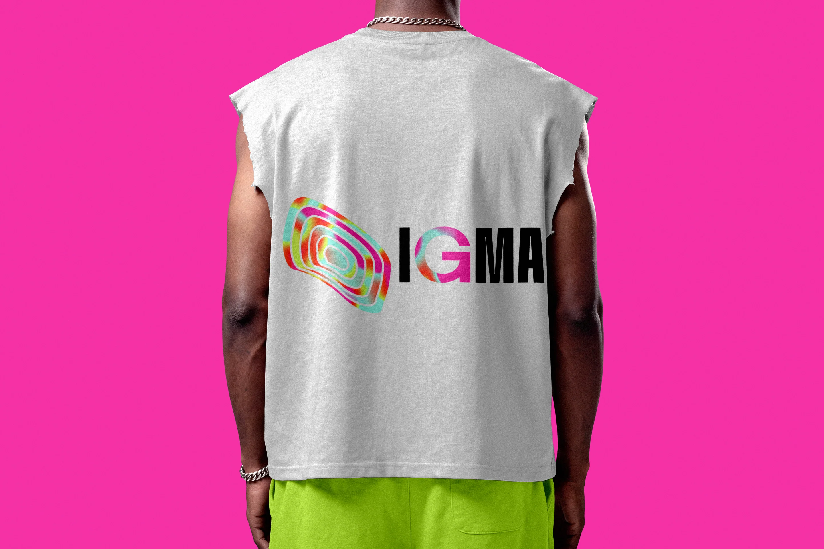 A field tank top printed with the IGMA lockup, on fuchsia.