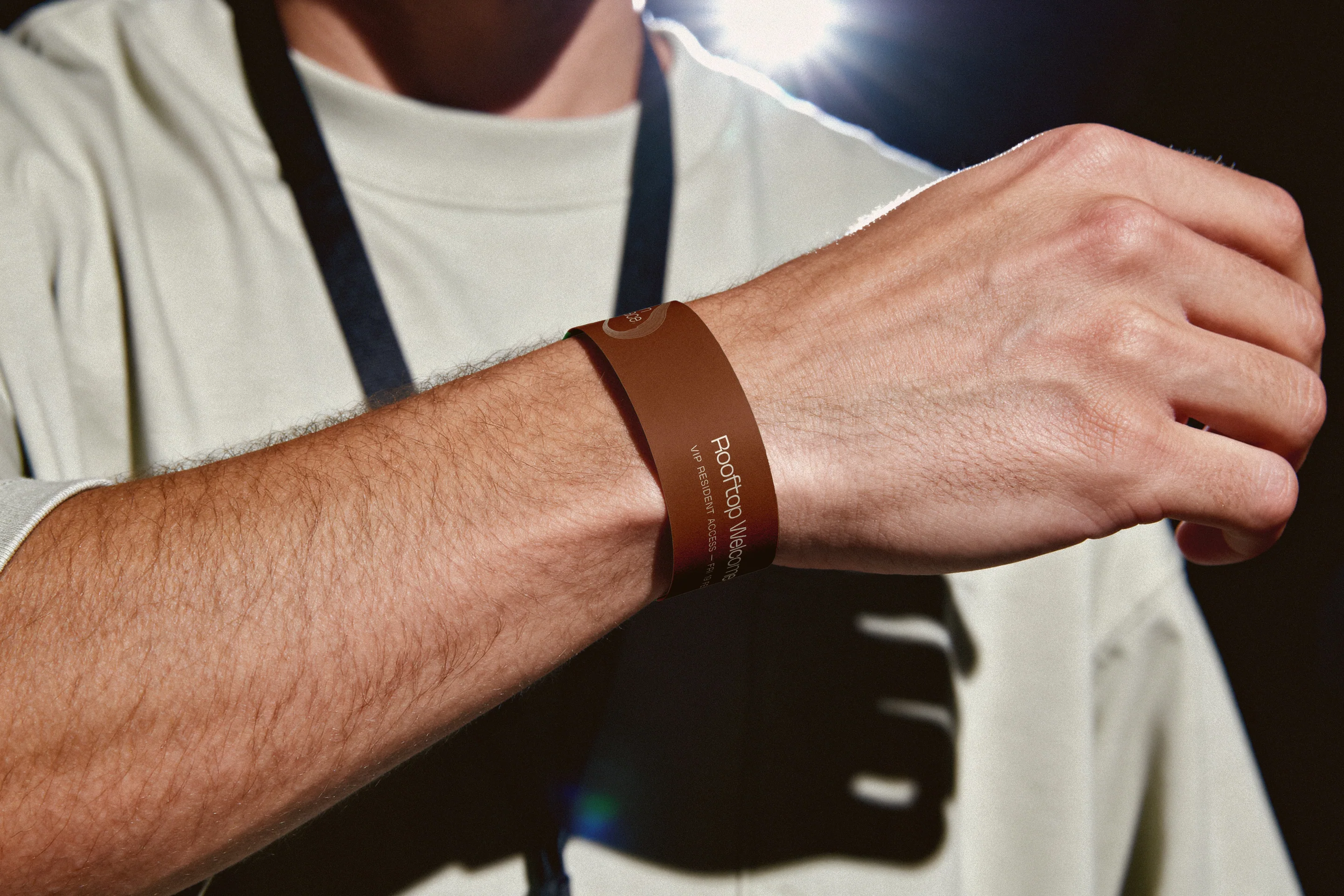 A copper event wristband on a resident’s wrist.