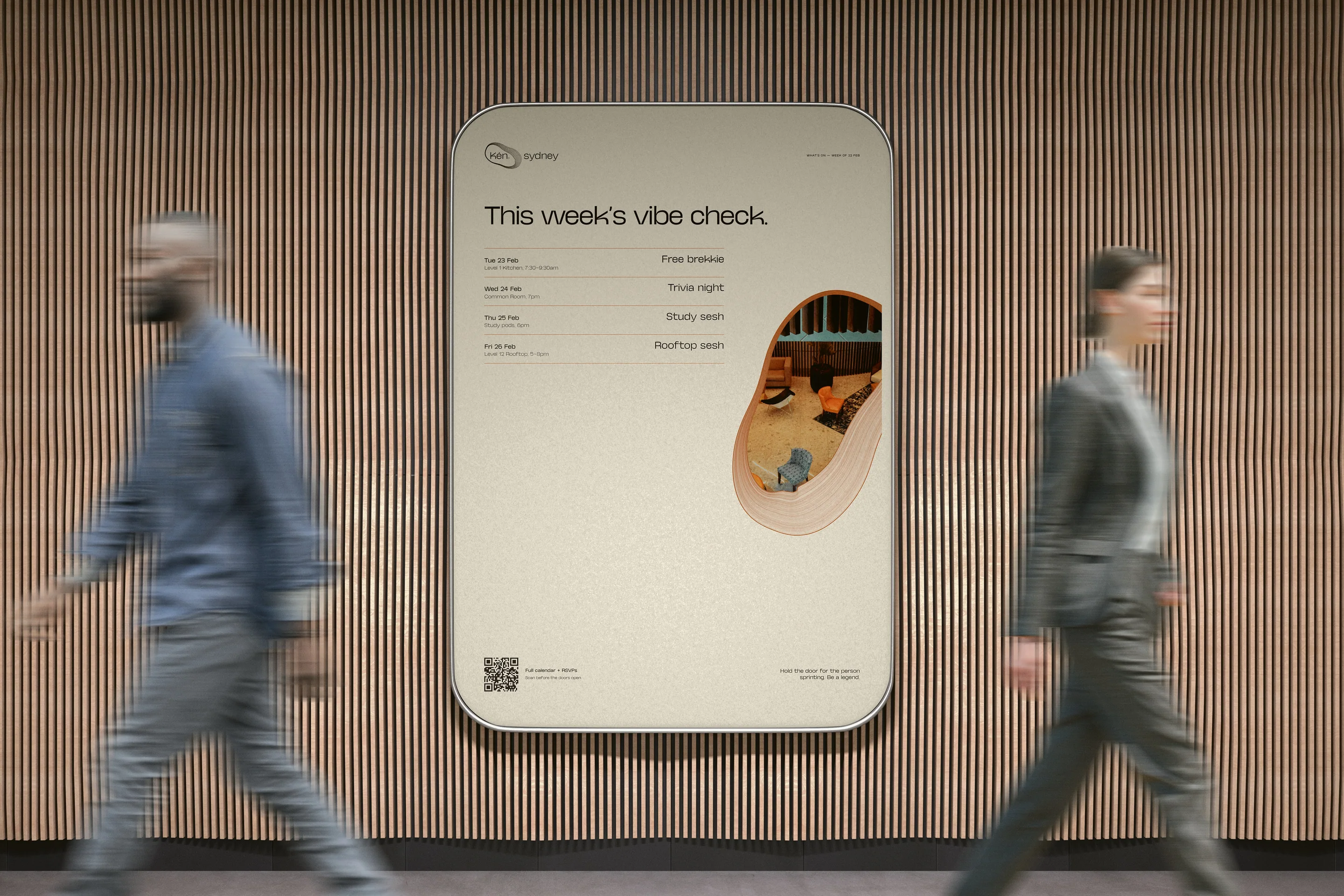 A lift poster asking for this week’s vibe check, with two residents walking past.