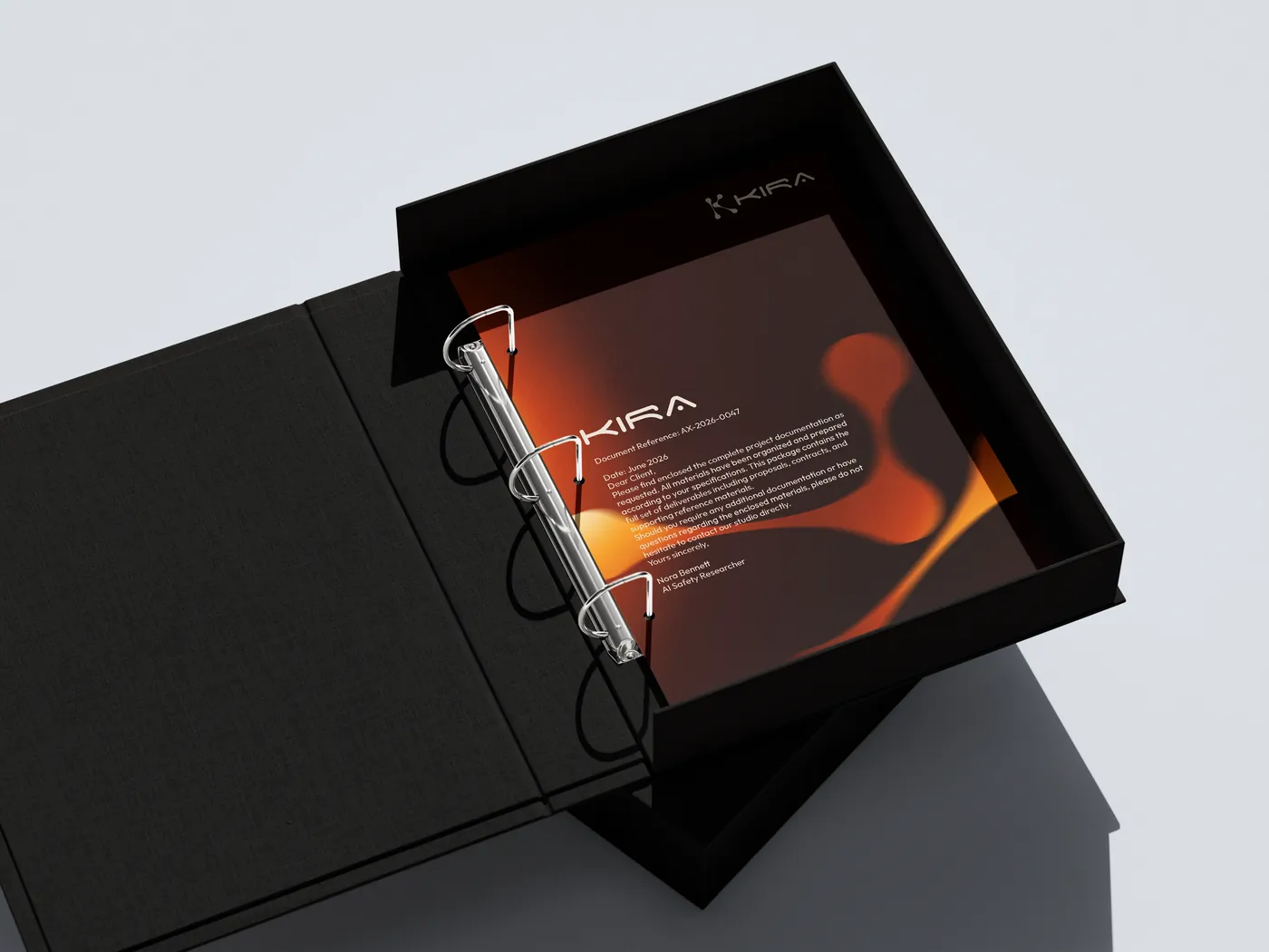 Kira press binder in a black archive box