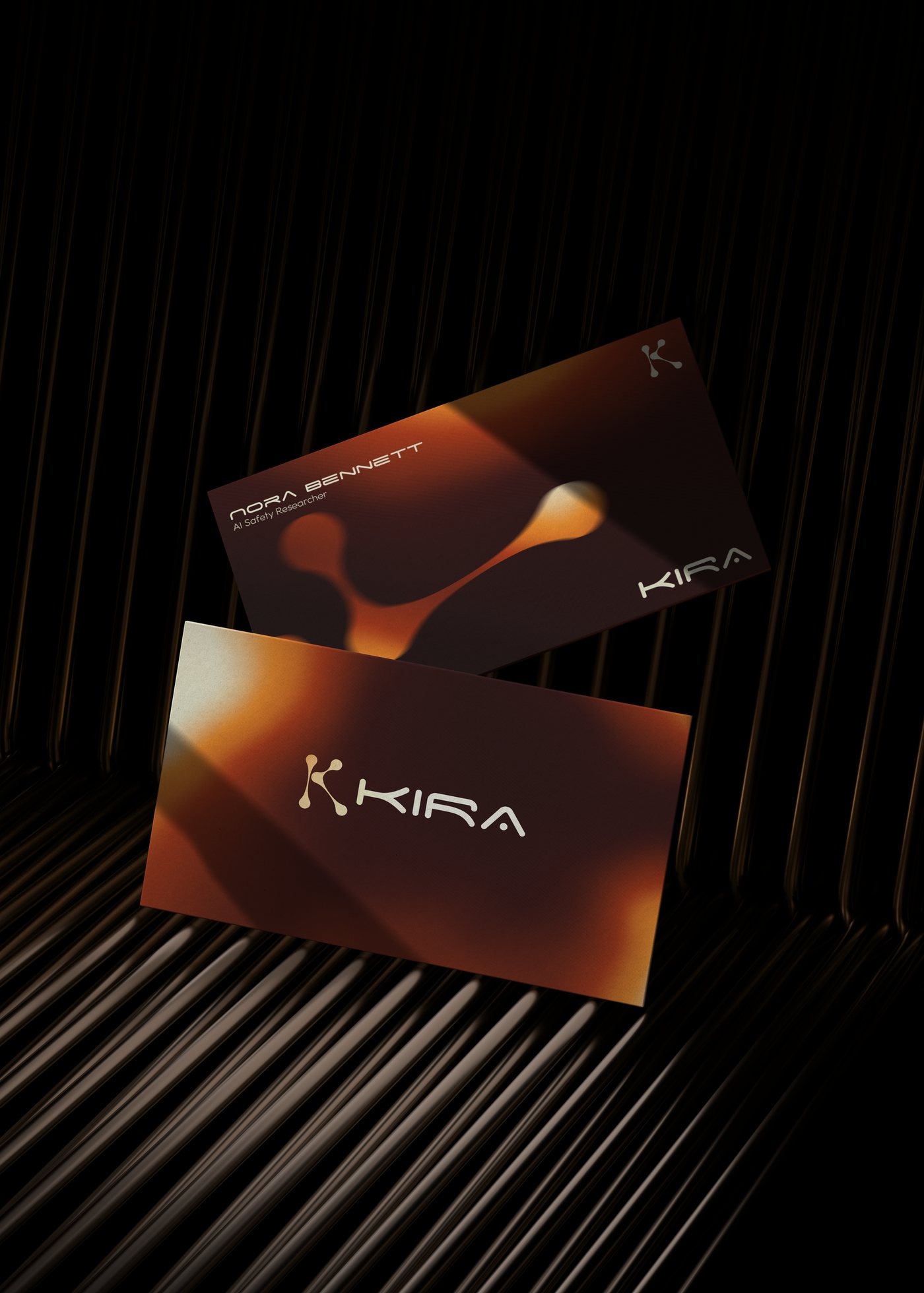 Kira business cards — molten gradient over black, the drawn wordmark in cream