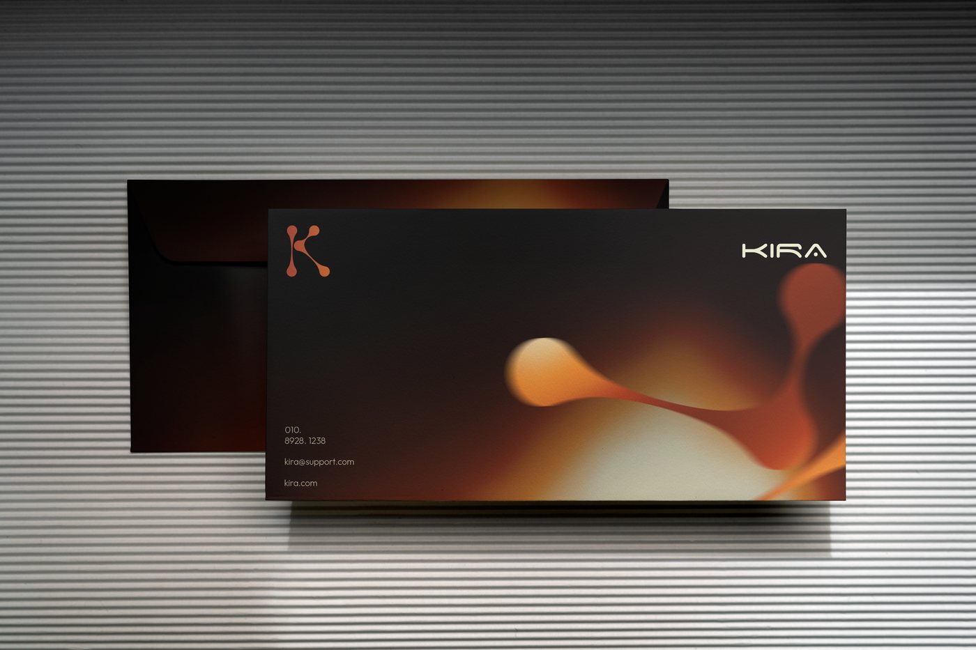 Kira envelope — the flame mark across the full face of the sleeve