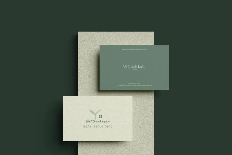 Stationery pair on pine green — the founder’s cards in green and cream