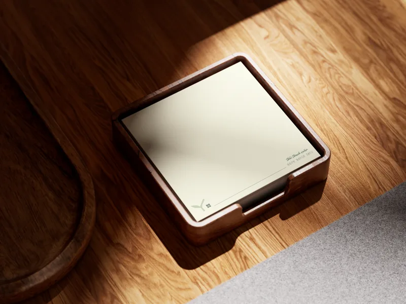 The wooden note cube from above, on warm timber