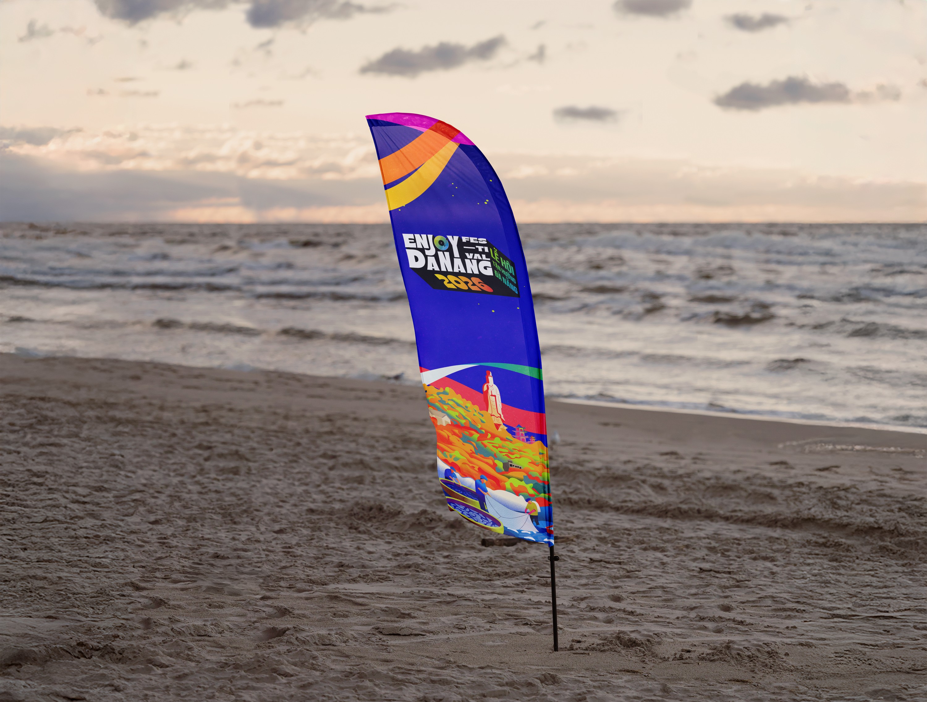 Enjoy Danang key visual applied to a street banner.