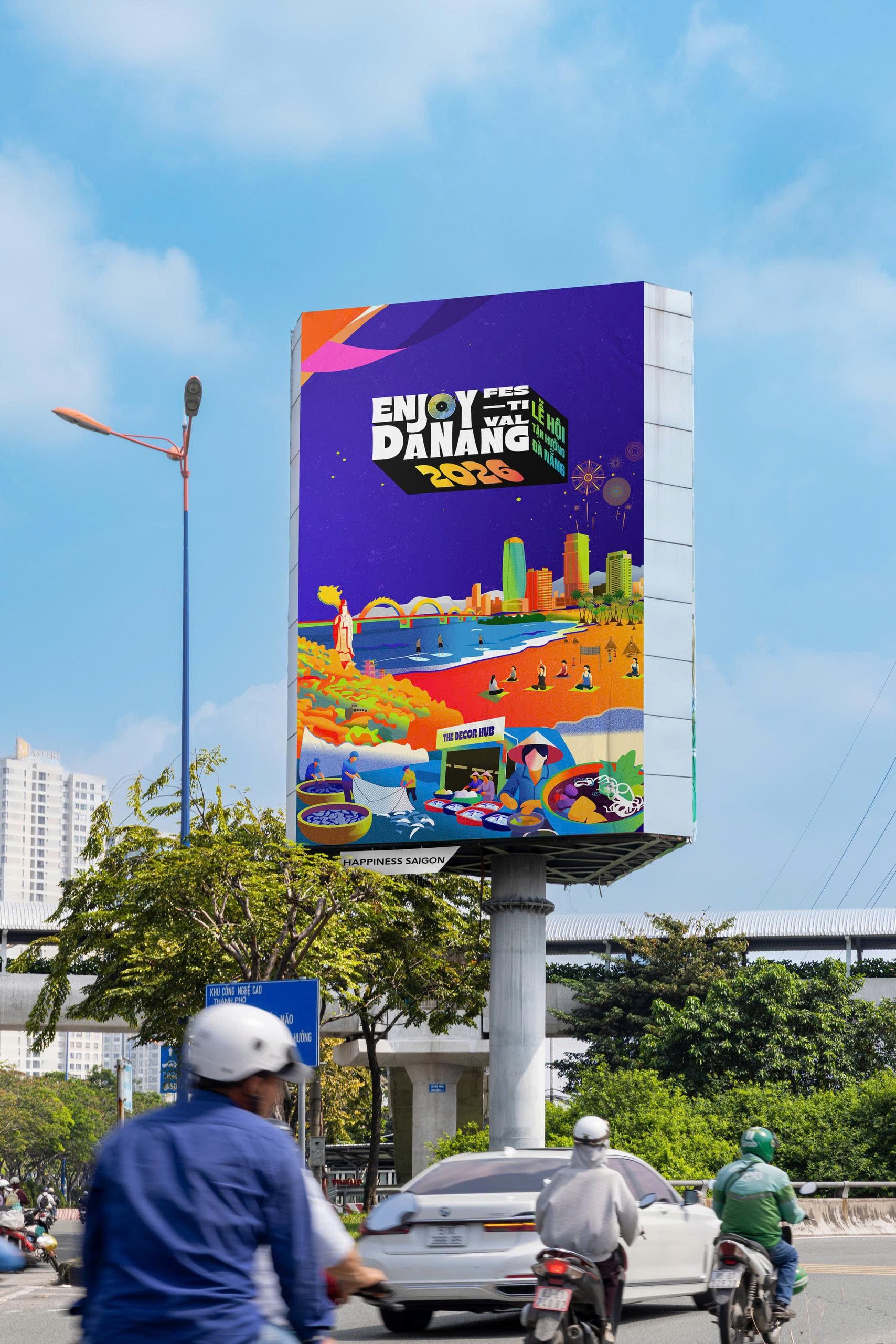 Enjoy Danang identity on a vertical roadside pylon.