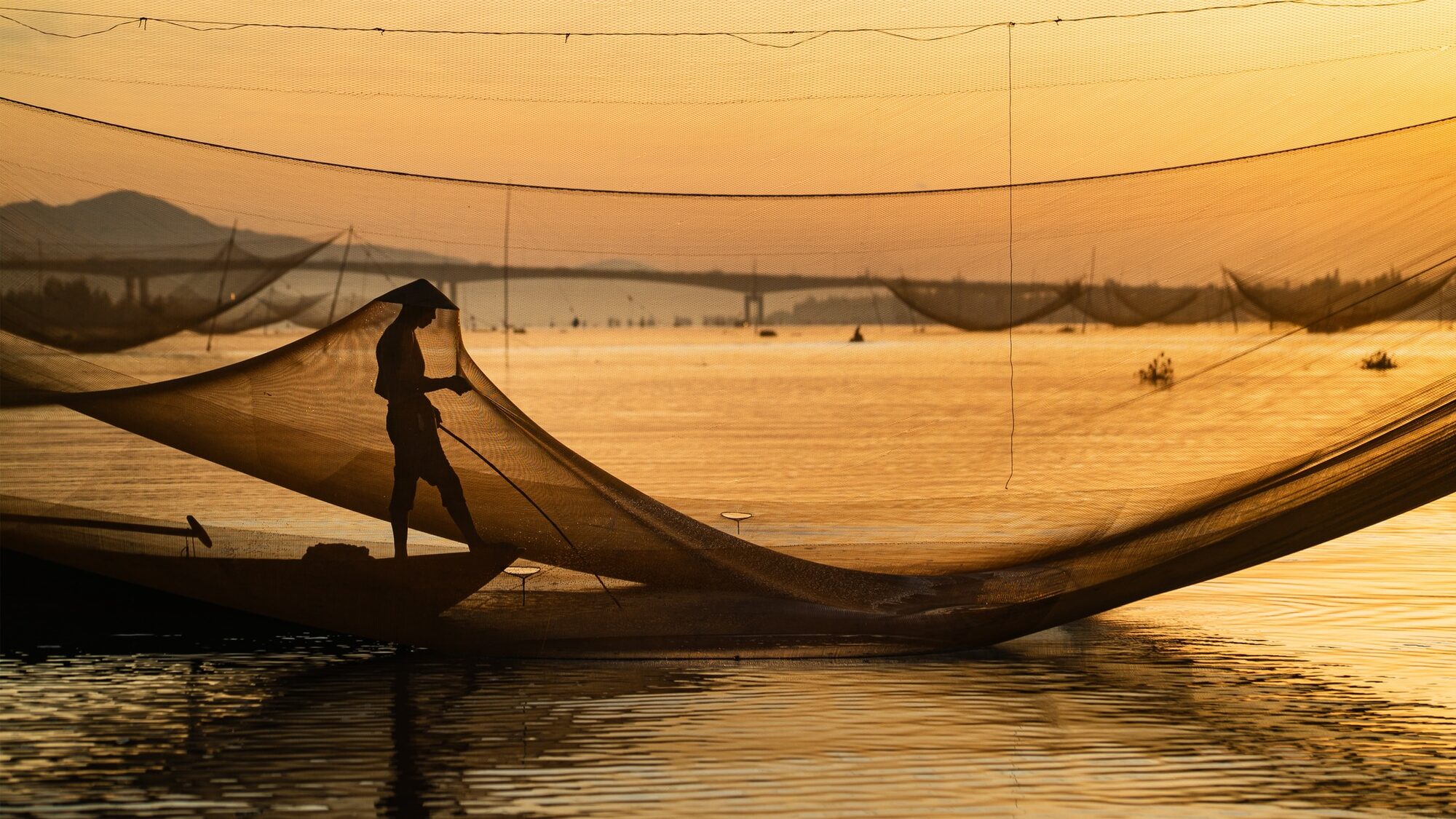 A Danang fisherman at work, full saturated colour.